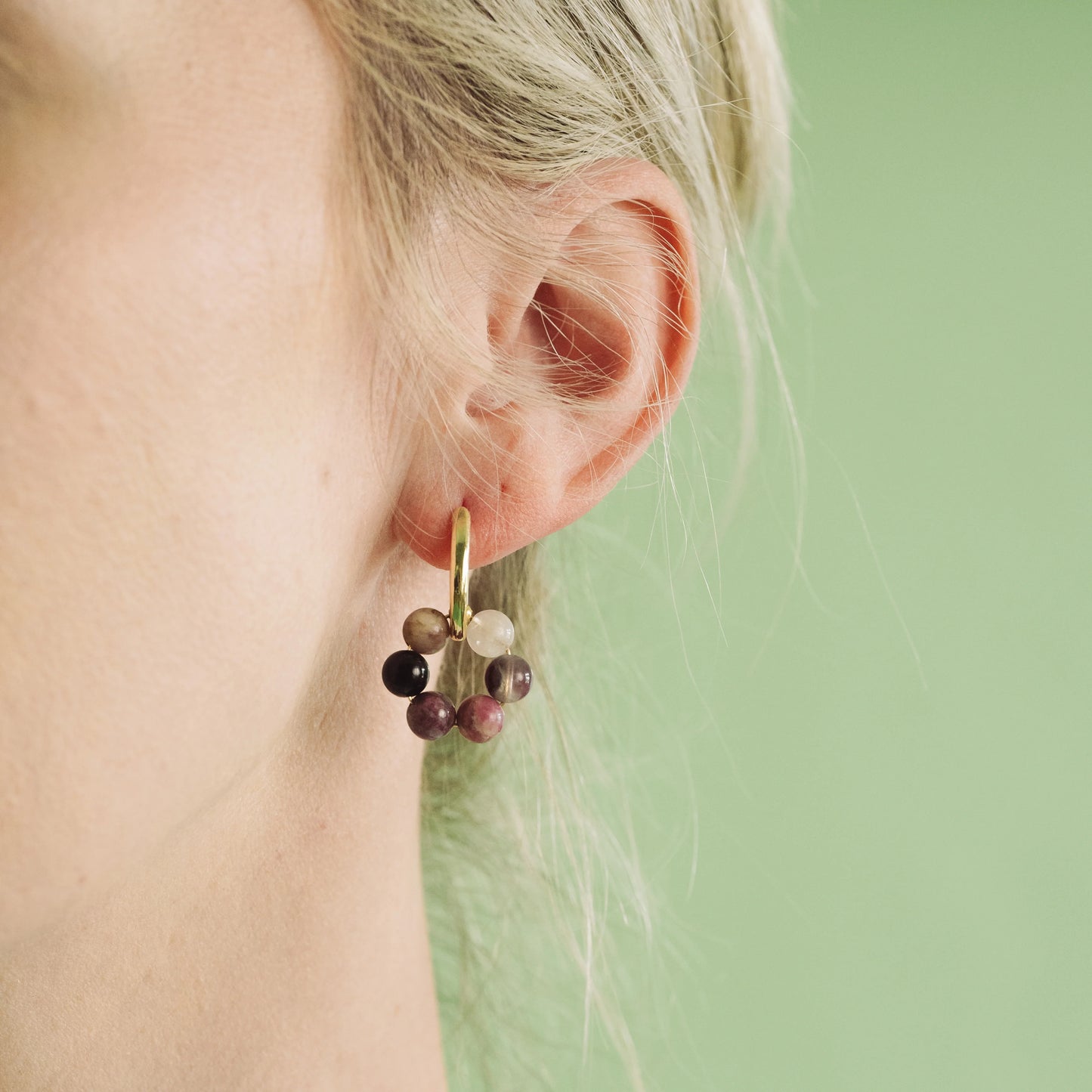 GOLD PLATED HUGGIE EARRINGS WITH CIRCLE GEMSTONE CHARM